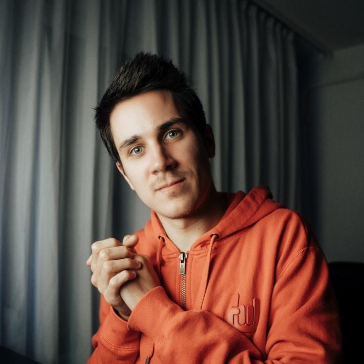 Lila Singh, Lead Design Curator at Reliable Growth Network, reviewing corporate floral arrangements